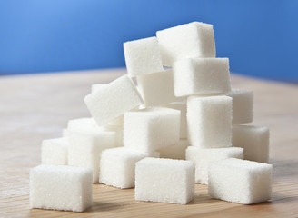 sugar cubes on wooden table