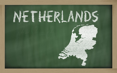 outline map of netherlands on blackboard