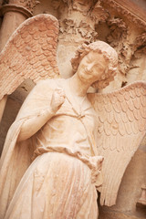 Famous smiling angel on facade of Reims Cathedral