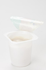 yogurt in plastic box container over white background