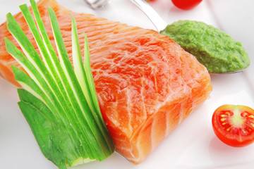 smoked salmon fillet and tomatoes with pesto sauce