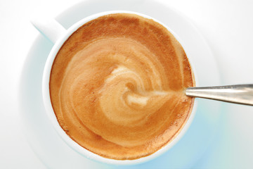 small white cup of cappuccino