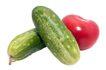 two cucumber and tomato isolated on a white background
