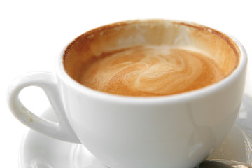 small white cup of cappuccino