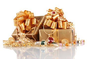 Various gold jewellery and gifts isolated on white