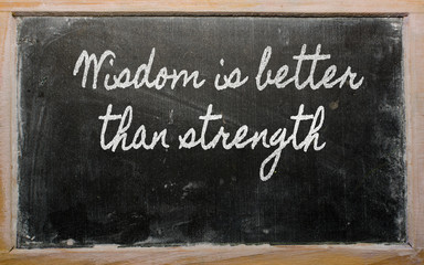 expression -  Wisdom is better than strength - written on a scho