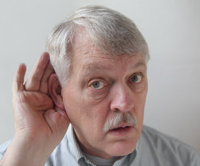 older man is hard of hearing