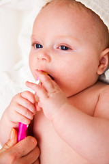 Infant with toothbrush