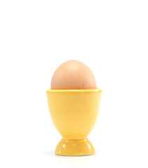 egg in yellow eggcup