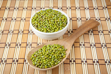 mung beans over wooden spoon