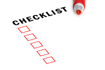 Checklist with red marker and checked boxes.