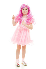 A girl with pink hair in a pink dress points to the top