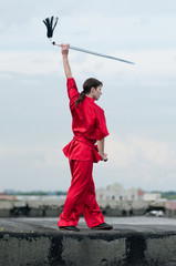 Fototapeta na wymiar Wushoo man in red practice martial art