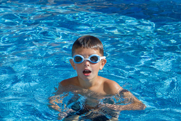 Boy with spectacles in the swimming pool