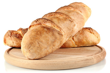 homemade bread on wooden breadboard isolated white background