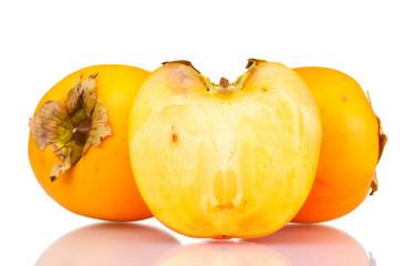 Two and half appetizing persimmons isolated on white