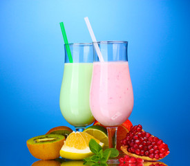 Milk shakes with fruits on blue background