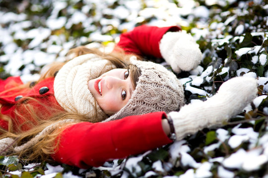 Young Woman Lying in the Snow