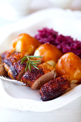 Duck breast with potato dumplings and red cabbage