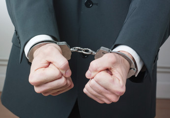 handcuffed businessman
