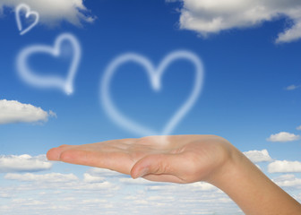 white hearts  in woman's hand