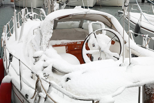 Boat With Snow In Harbor