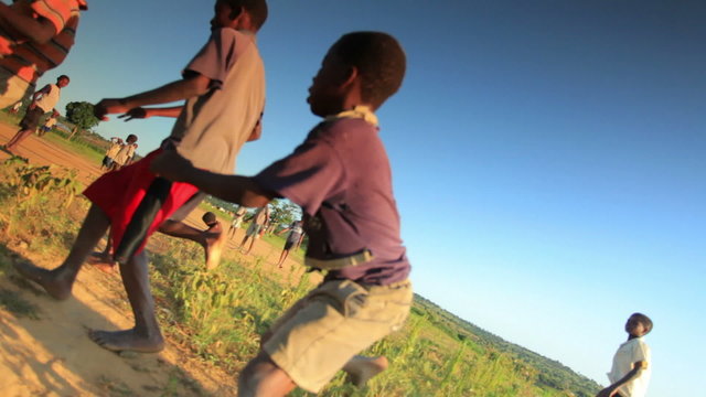 African Children Playing In The Fields In Kenya.