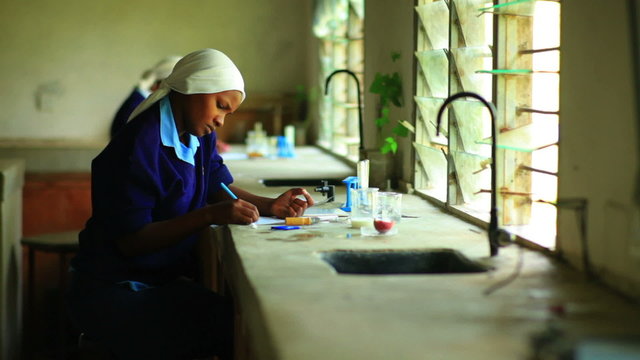 African school girls studying chemistry in Kenya, Africa.
