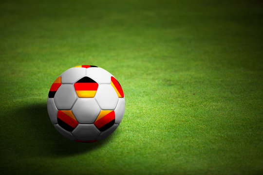 Flag of Germany with soccer ball over grass - Euro 2012