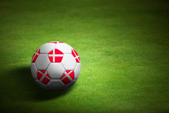 Flag of Denmark with soccer ball over grass - Euro 2012