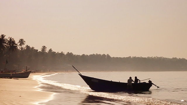Fishing boat arriving at a magnificent Goan beach