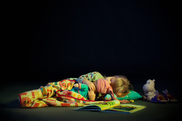 Fototapeta na wymiar Sleeping girl cuddling doll