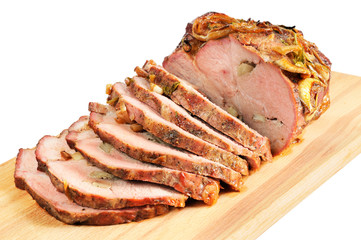 Roast pork on a wooden board