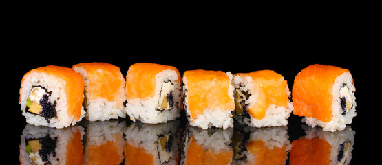 Tasty rolls in line isolated on black