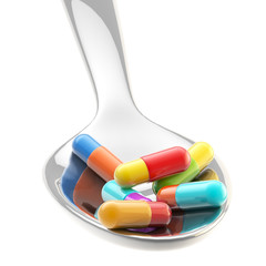 Metall spoon with a portion of medicine isolated