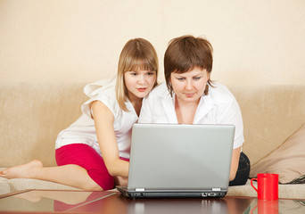 Two young women  with laptop