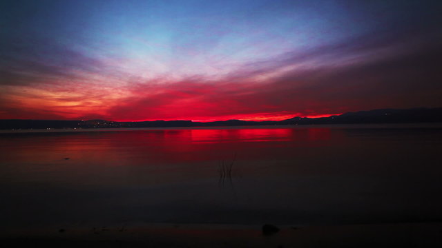 Stock Video Footage of a beautiful, colorful sunset at the Sea of Galilee in Israel.