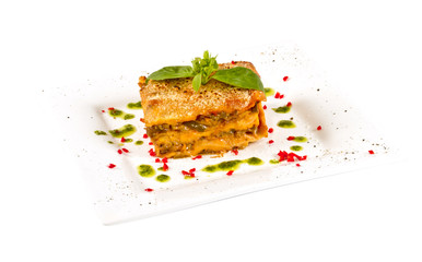 Closeup of lasagna and basil fork