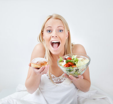 Tempted Young Woman Making A Food Choice