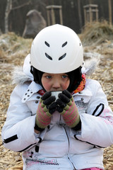 A child drinking a hot drink at the court © aglebocka