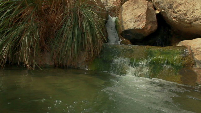 Stock Video Footage of a stream cascading between boulders in Israel.
