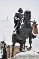 The snow covered statue of Mathias King, Cluj Napoca, Romania