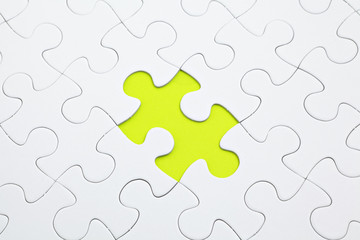 Jigsaw puzzle with green piece missed