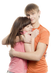 The girl and the young men joyfully embrace