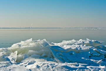 Drifting ice on the shore of a lake