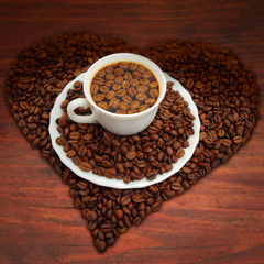 Warm cup of coffee on a wooden table