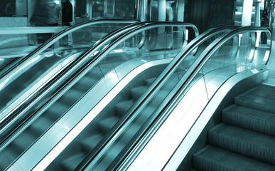 Three moving escalators