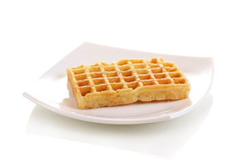 Sweet waffles on plate isolated on white