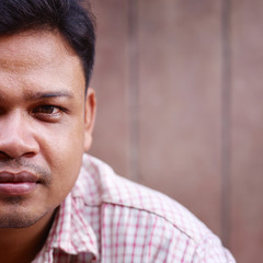 mid adult asian man looking at camera