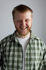 Fototapeta premium Young man in a plaid shirt